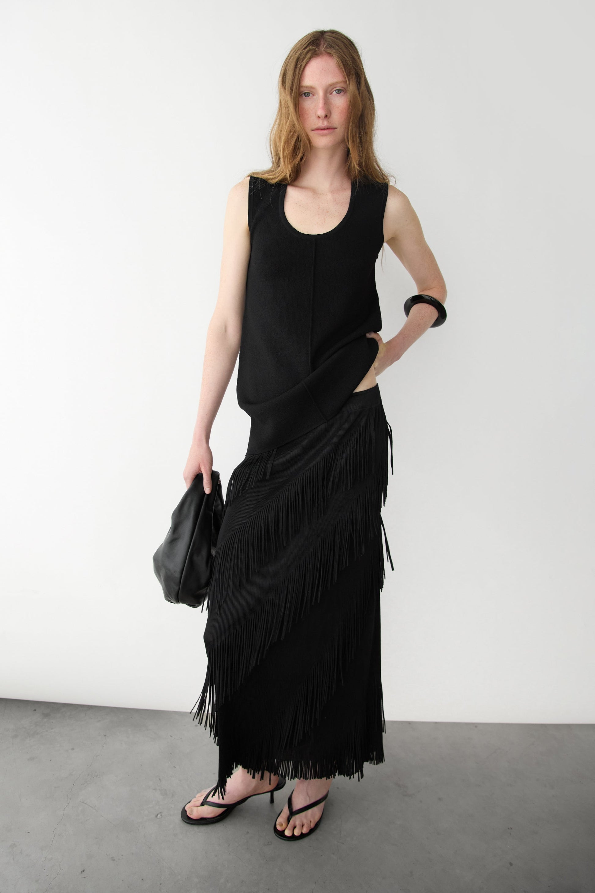 ASYMMETRICAL FRINGE SKIRT